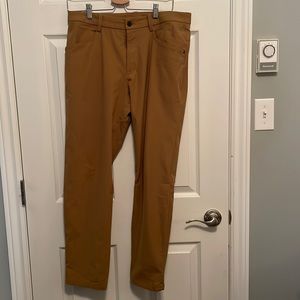 LuLulemon Men’s pants, size 34. Rust color. Back & front pockets.